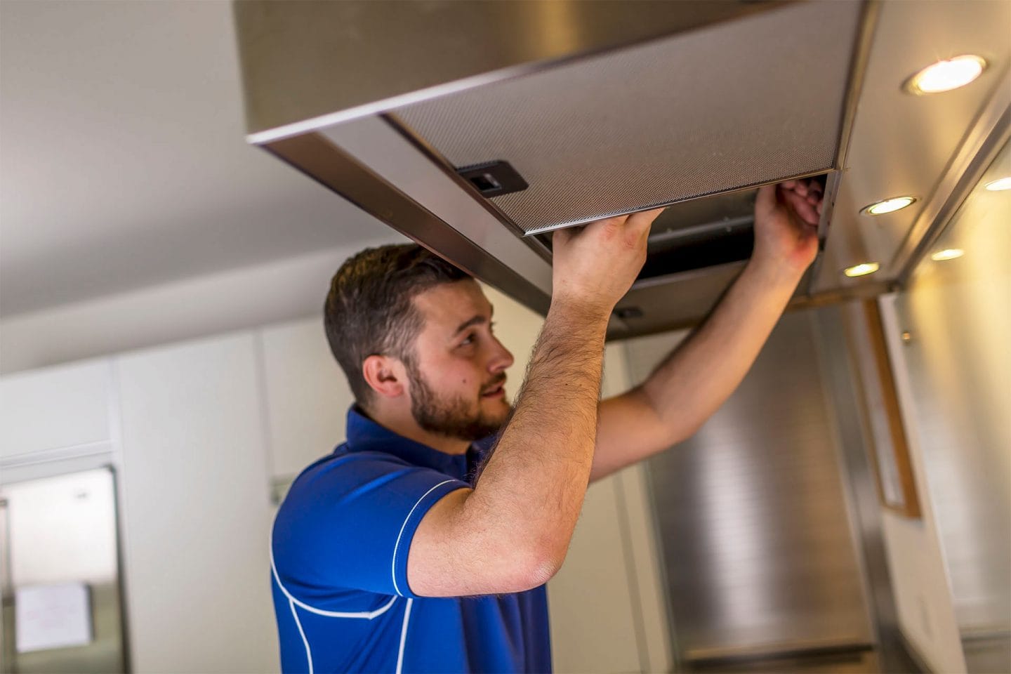Kitchen hood installer fitting commercial canopy in Newbury