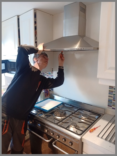 Kitchen hood installer in Newbury preparing commercial extraction canopy